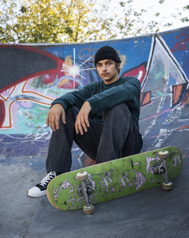 skater sitting skatepark